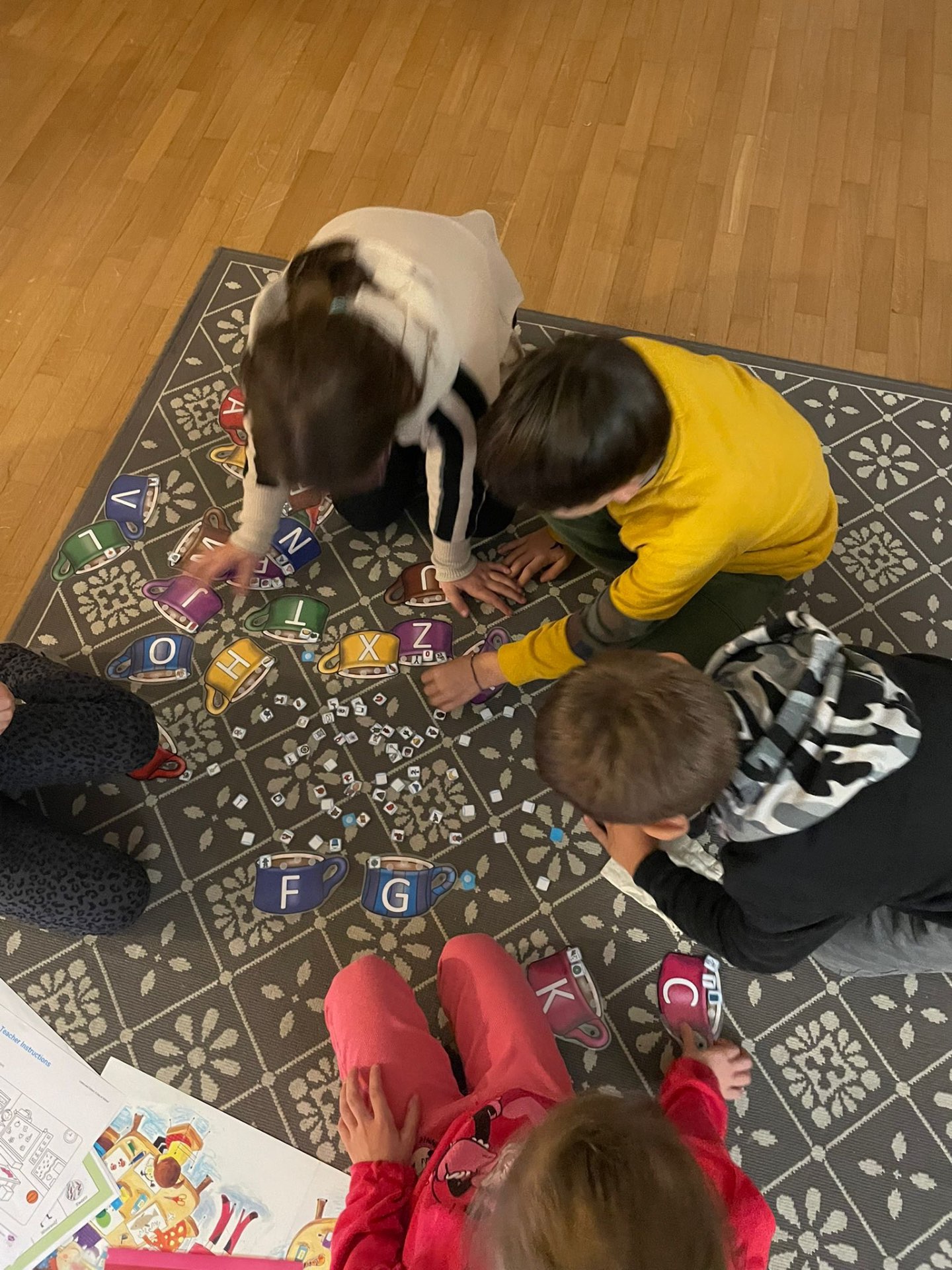 Children playing an alphabet matching game together