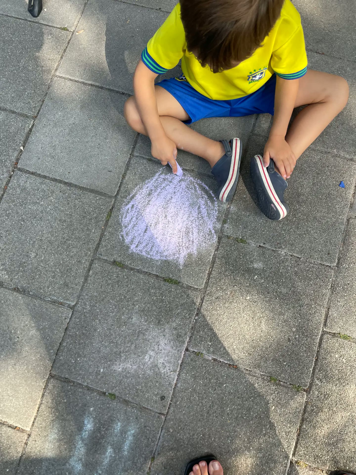 Chalk drawing outside during a playful lesson